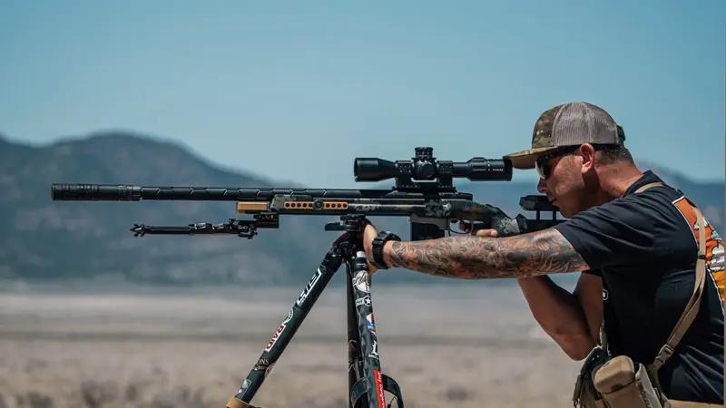 Member running a precision rifle from a tripod