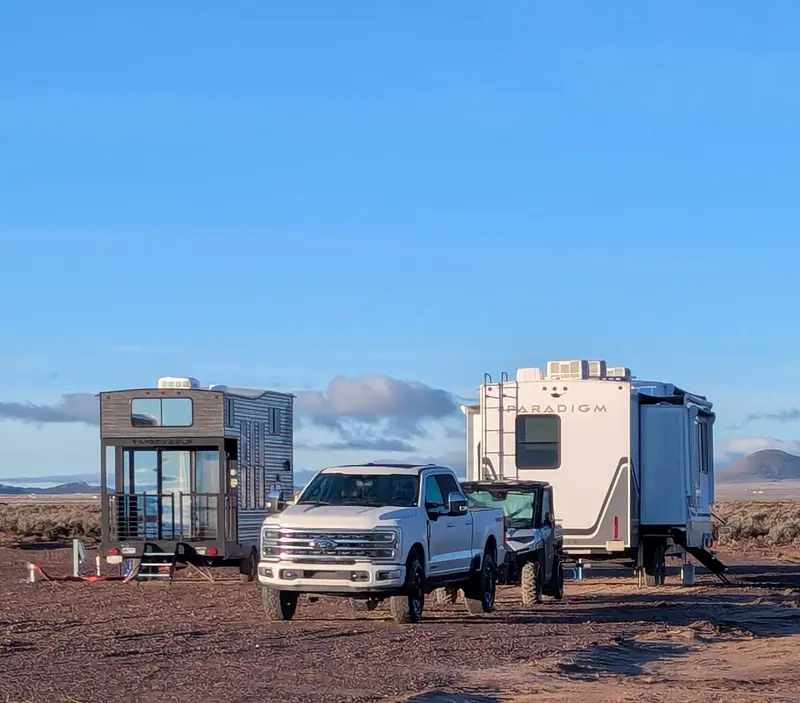 Truck and fifth-wheels parked at the onsite RV park